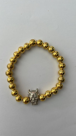 Angelito Negro – Pulsera dorada diablo plateado